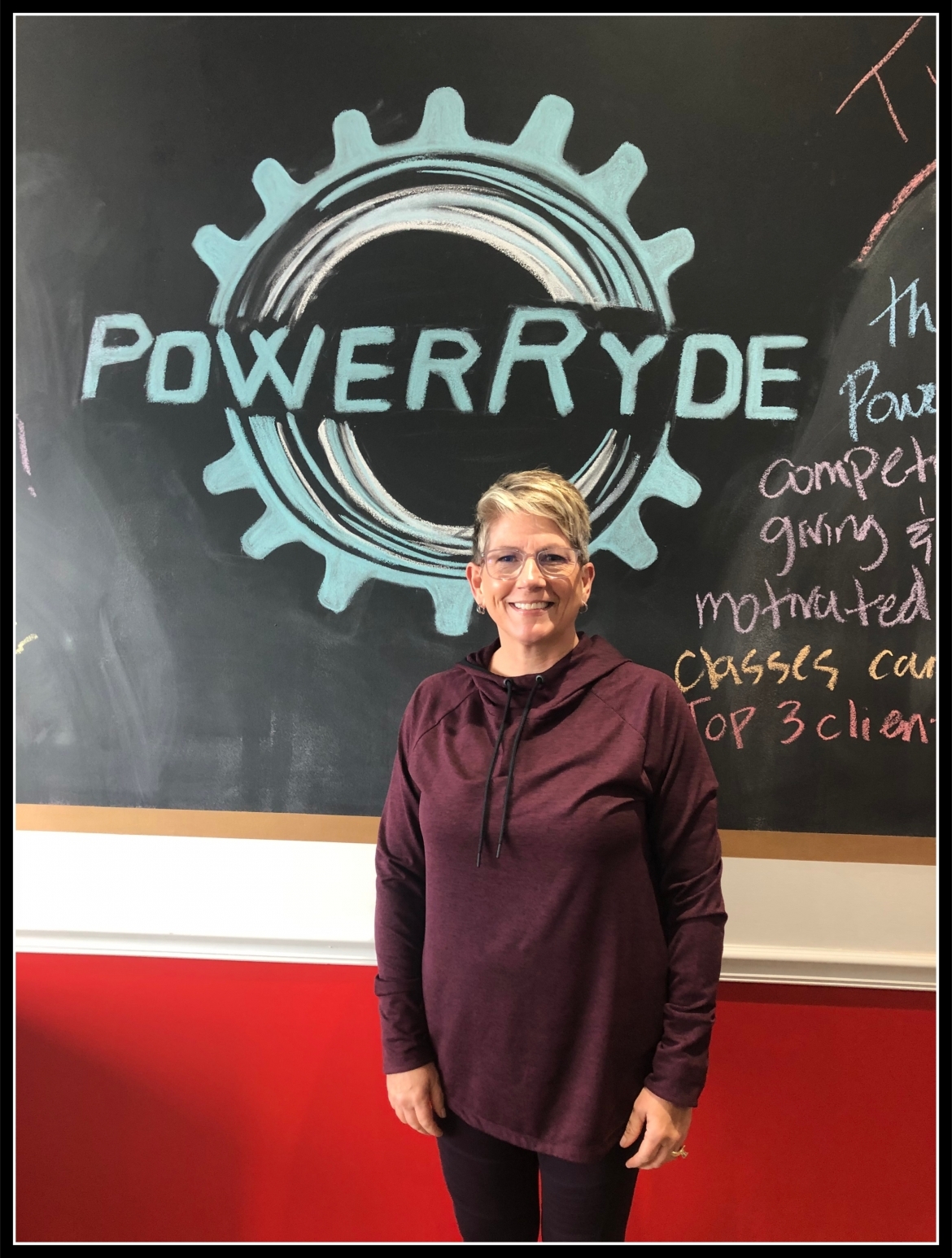 Carey Rivard in front of chalk PowerRyde logo